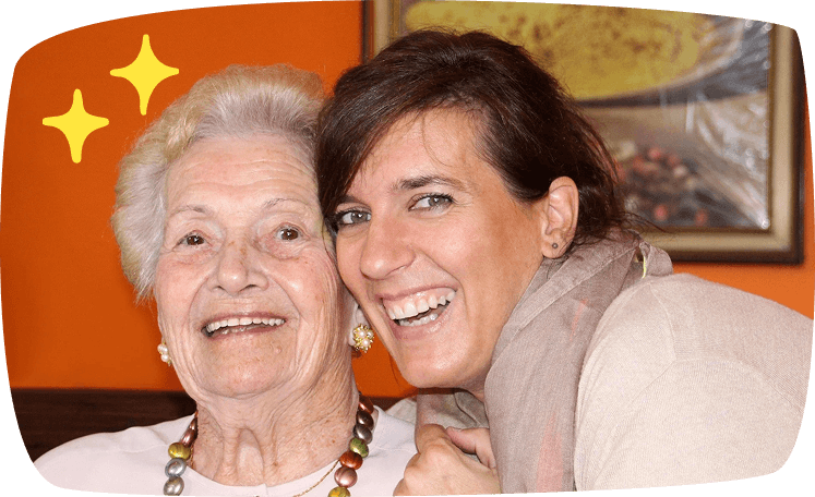 girl and senior lady smiling